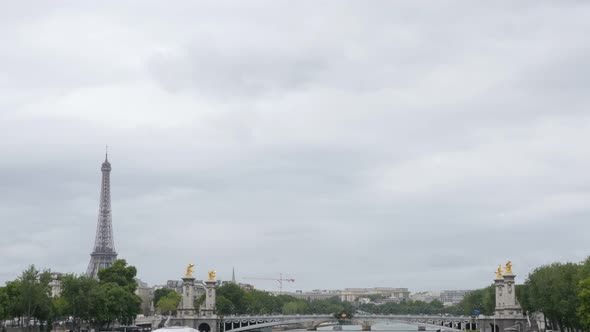 Beautiful Paris scenery with river Seine Eiffel tower and Alexandre III bridge 4K 2160p UltraHD tilt alt