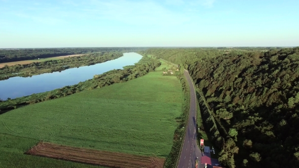 Aerial Landcape Of River In Green Meadows