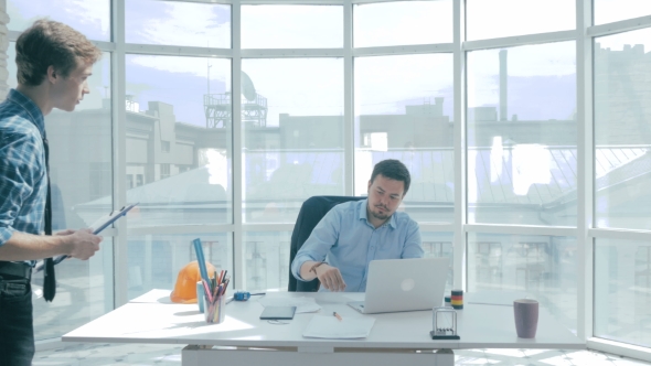 Director Discuss Project With Employee, Gives Advice, Using Digital Tablet In New Modern Office. alt