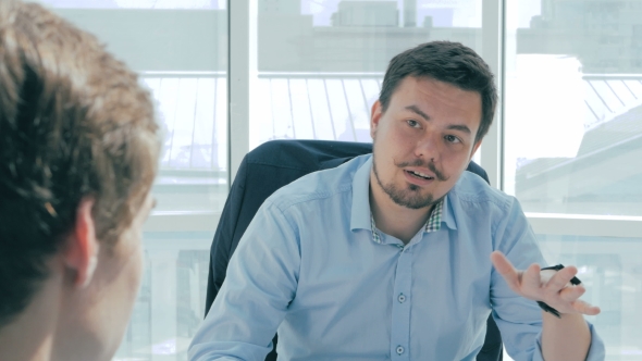 Director Discuss Project With Employee In New Modern Office. alt