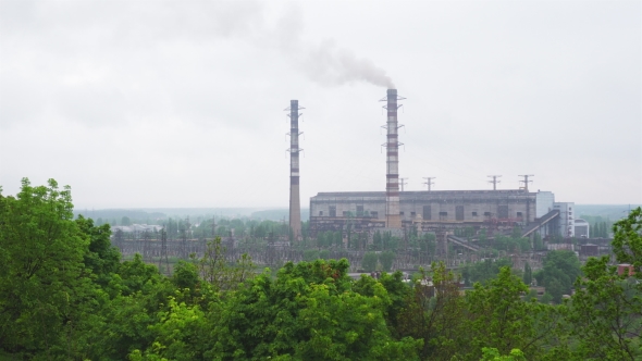 Working Coal-fired Power Plant with High Tubes and Smoke Near Trypillia Village