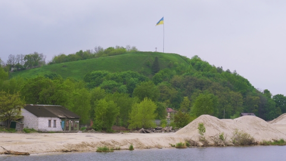 Ukrainian Flag Fluttering Over Devich Mountain In Trypillia Village, Ukraine