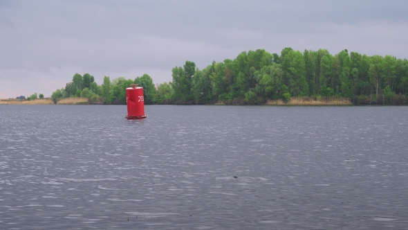 Red Buoy Floating On Fresh Water River