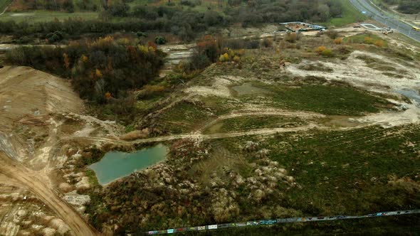 Construction site in a city vacant lot. Photographed in cloudy weather. Aerial photography. alt