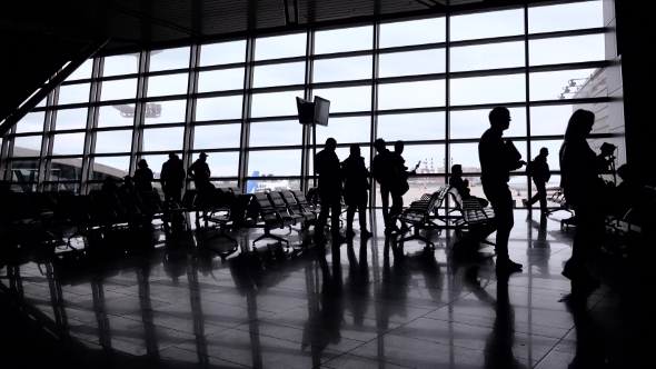 Silhouettes Of People In Modern Hall