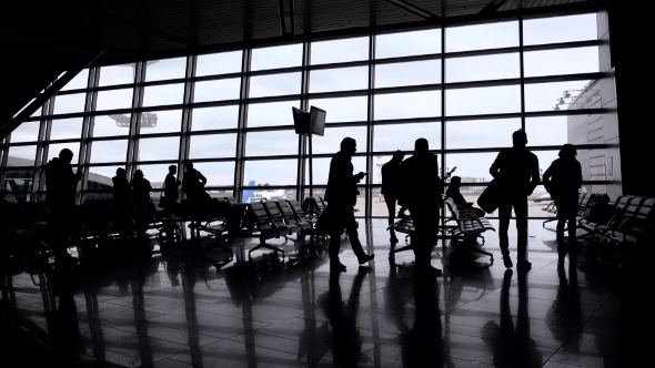 Silhouettes Of People In Modern Hall