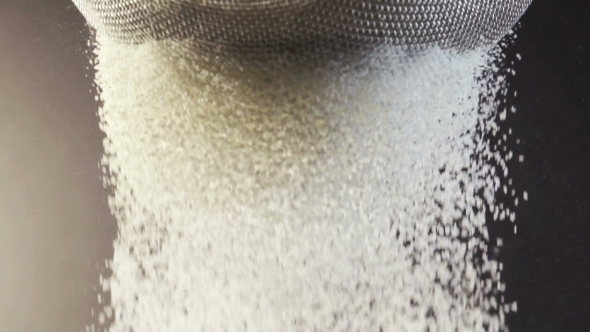 Flour Falling Through a Metal Sieve alt