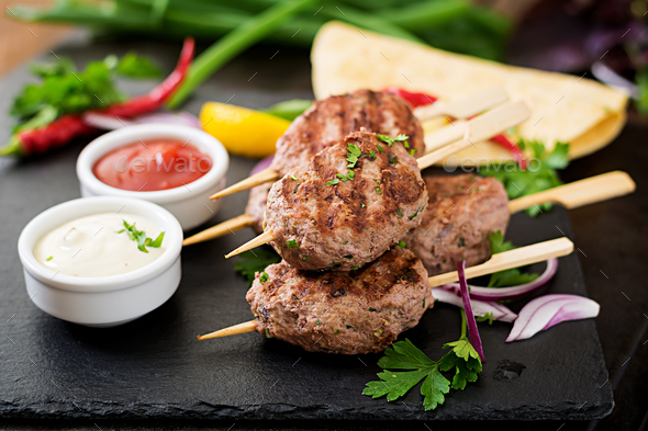 Appetizing Kofta Kebab Meatballs With Sauce And Tortillas Tacos On Black Background Stock Photo By Timolina