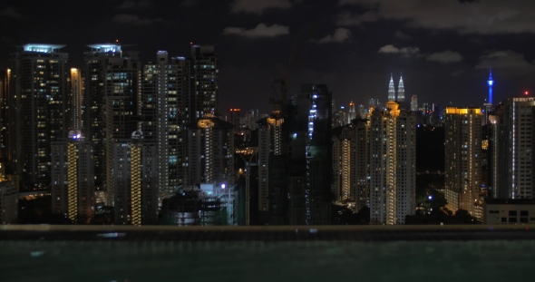 From Pool On Roof Of a Hotel In Kuala Lumpur, Malaysia Seen Night City alt