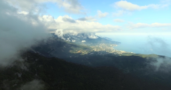 Mountains With City By The Sea