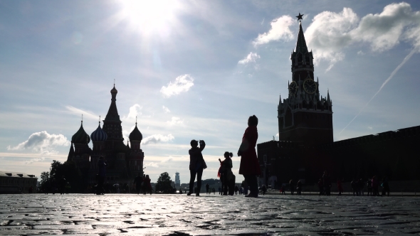 Silhouettes Of Tourists Visiting Moscow Kremlin, Red Square And Saint Basil's Cathedral alt