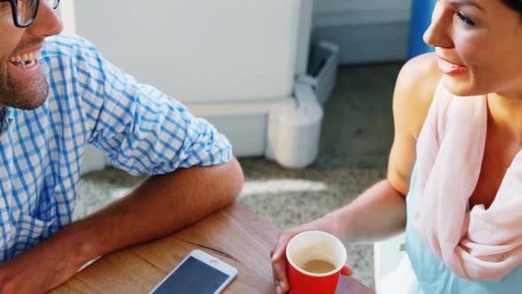 Business executives interacting with each other alt