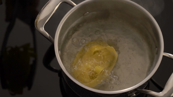 Cooking Nest Pasta In Boiling Water On Electric Stove