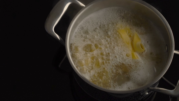 Cooking Nest Pasta In Boiling Water In Pot On Electric Stove