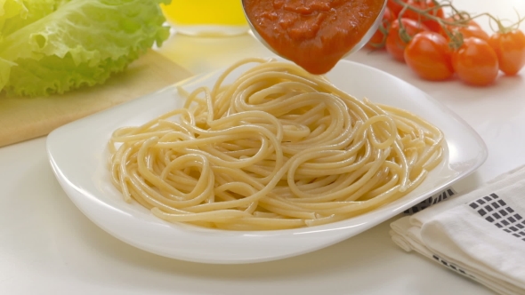 Putting Tomato Sauce On Spaghetti