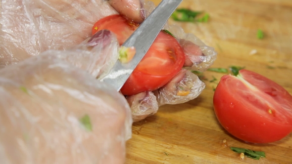 Hands Cut Tomatoes For Salad