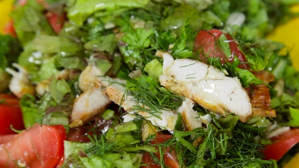 Woman Tossing Green Salad