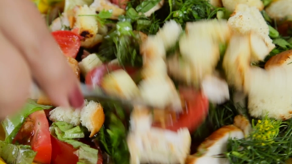 Woman Tossing Green Salad