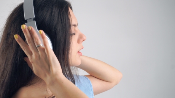 Woman In Headphones Listening Music