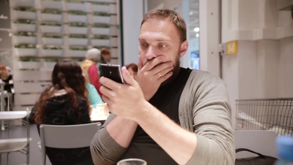 Feeling Surprised. Man Is Being Emotional Looking At His Smartphone. Man s Facepalm. Man Is Putting alt