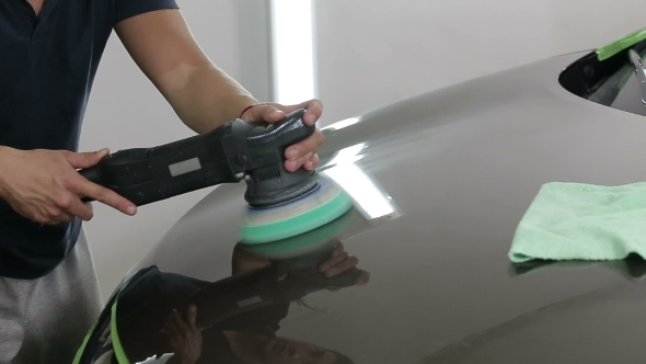 Shot Worker Polish Brown Car With Special Tools alt