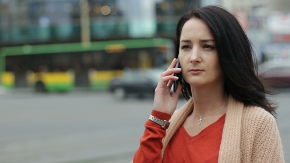 Girl Talking On The Phone In The City