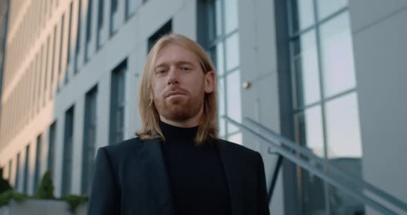 Portrait of Handsome Bearded Man in Suit Turning Head and Looking To Camera. Crop View of Successful alt