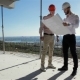 Two Builders Meet At The Building Under Construction - VideoHive Item for Sale