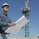 Construction Manager Look At The Sheet With Plan Of Building Under Construction - VideoHive Item for Sale