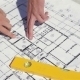 Male Fingers Point At The Plan Of The Building Construction - VideoHive Item for Sale