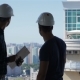 Builder Points At The Penthouse Near The Building Under Construction - VideoHive Item for Sale
