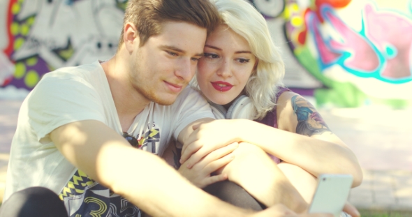 Loving Trendy Young Couple Taking a Selfie alt