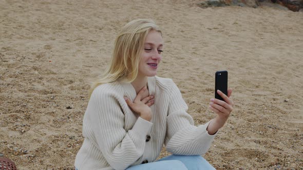Pretty Blonde Woman Has Video Call On Mobile Phone
