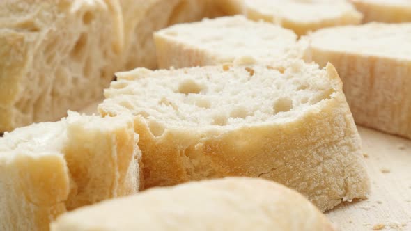 French baguette pieces on the table  close-up tilt 4K 2160p UltraHD  footage - Fresh traditional in  alt