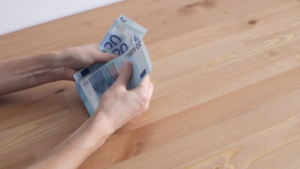 Woman Counting Euro