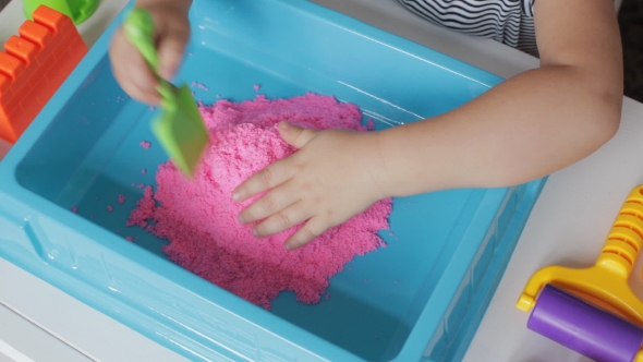 Pink Kinetic Sand And Hands