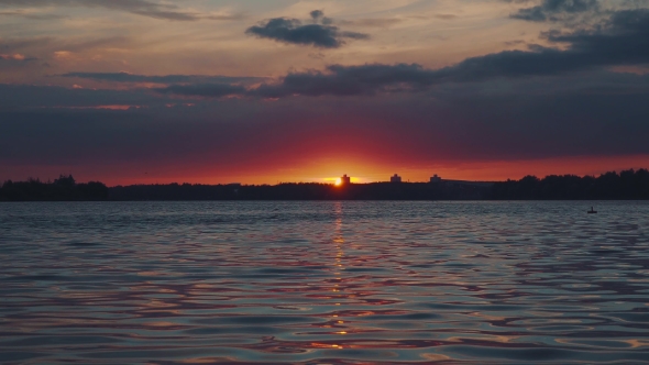 Sunset Over The Water. Interesting Unusual Light.