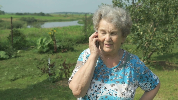 Old Woman 80s Tells On The Mobile Phone