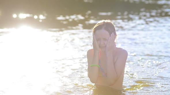 Girl Splashes With Water. alt