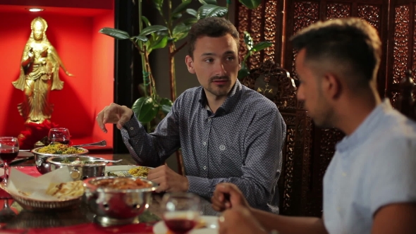 Two Men Dining At The Restaurant alt