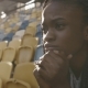 Portrait Of Young African American Train Woman Sitting At The Stadium And Fixedly Look For - VideoHive Item for Sale