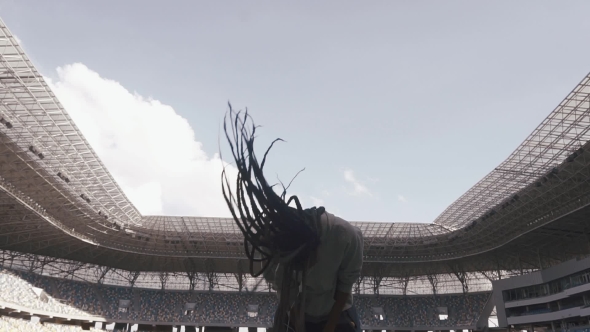 African-american Girl Play With Her Hair In The Middle Of Stadium