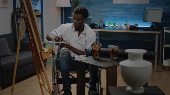 Black Disabled Artist Working on Modern Drawing at Studio alt
