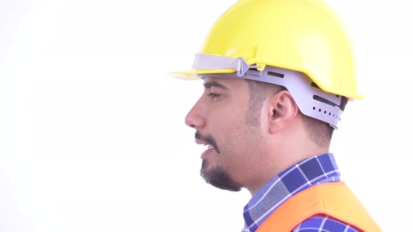 Closeup Profile View of Happy Bearded Persian Man Construction Worker Talking alt
