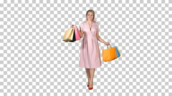 Young blonde girl in pink dress showing to camera shopping alt