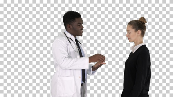 Male doctor offers medication to young woman, Alpha Channel alt