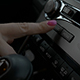 Using Car Audio Stereo System. Woman Typing Radio Button in Car Using Car Audio Stereo System. Woman Typing Radio Button in Car - VideoHive Item for Sale