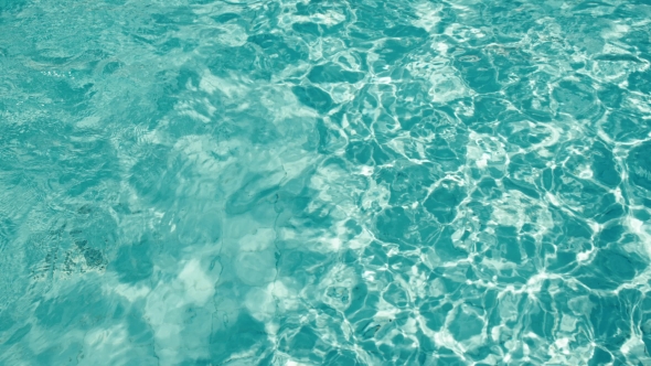 Blue Water Rippled Background in Swimming Pool alt