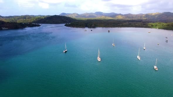 Natural Harbor with Anchored Sail Boats by the Caribbean Sea