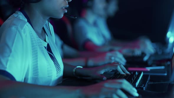 Esports Female Gamer Plays a Video Game Closeup View of Hands on the Keyboard Blue Neon Light Game alt